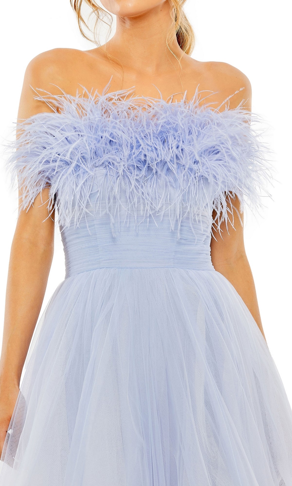 A person wearing the Long Formal Dress 20557 by Mac Duggal, a strapless light blue tulle ball gown with an elegant ombre feather trim along the top.